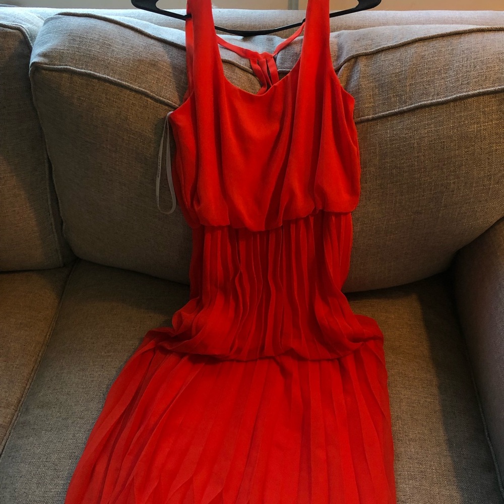Women’s maxi red/orange party dress, with a flowy pleated skirt. Bisou Bisou.